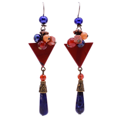 Dangle drop earrings made of Austrian crystal, handworked brass, glass and dyed shell. Titanium hooks. By Honica.