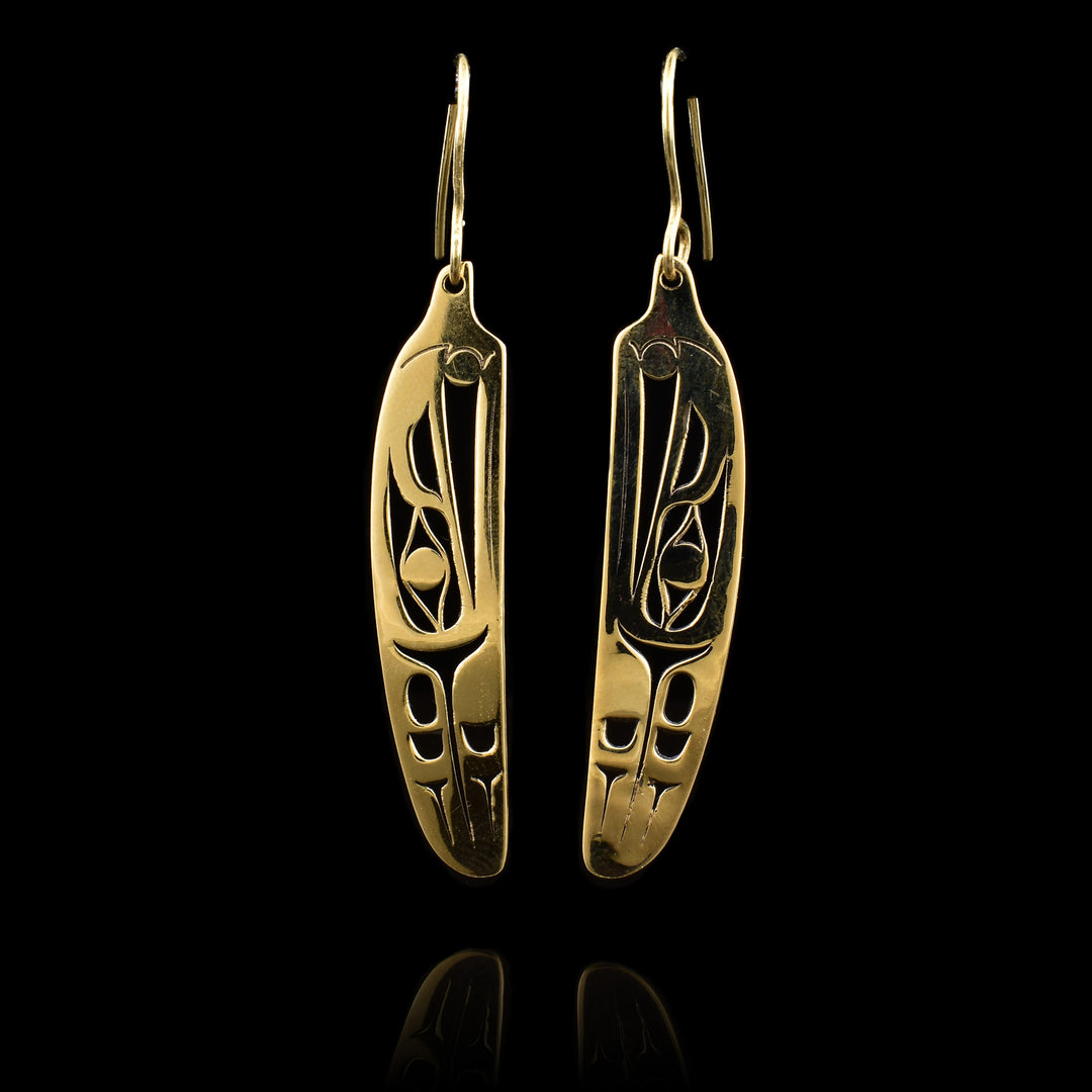 These dangling, 14K gold feather earrings have feather shaped hangs with cutout depictions of the Raven on them.