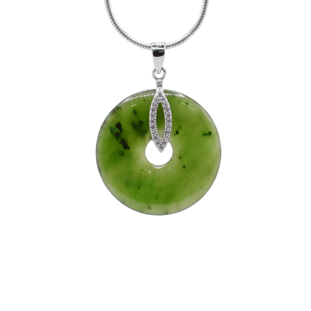 Discover our stunning Green Jade Donut Pendant. Accented by a sparkling cubic zirconia marquise bail, this classic circle necklace adds timeless elegance.