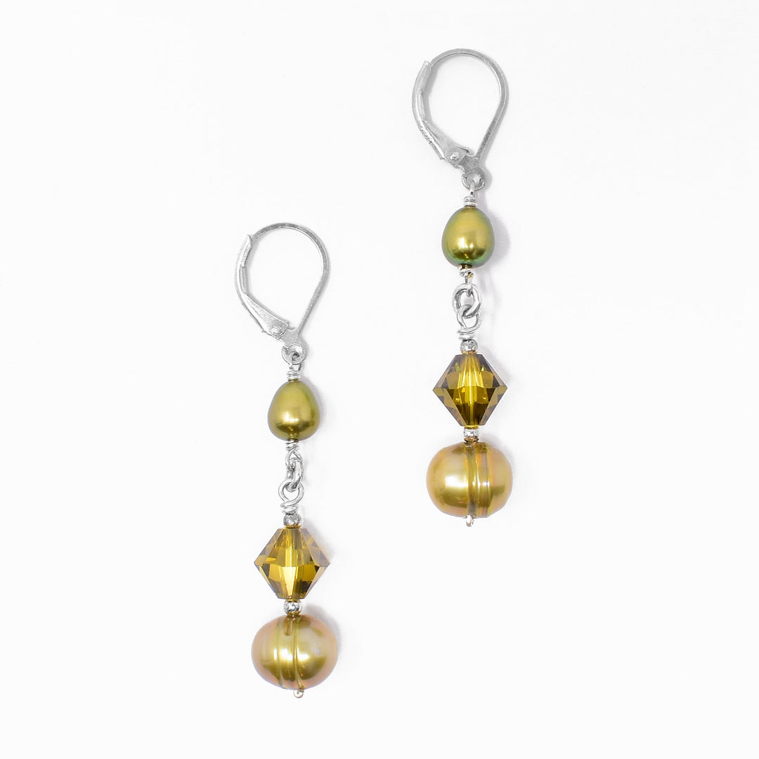 Lever-back earrings with green freshwater pearls and green bicone Swarovski crystals. Each earring measures 2” x 0.38” including hook.