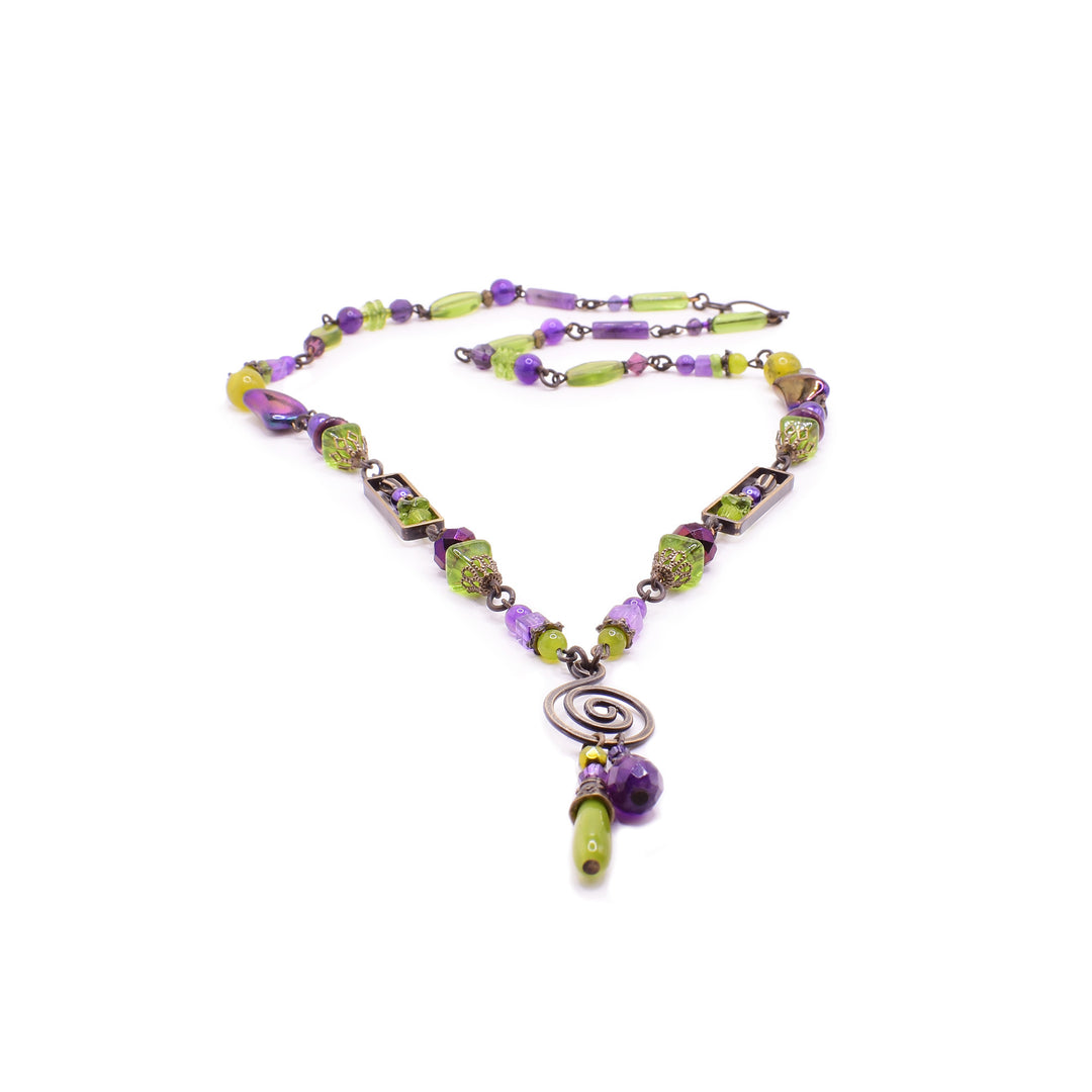 Glass beads of purple and green combined with beautiful brass work creating a beautiful statement necklace.