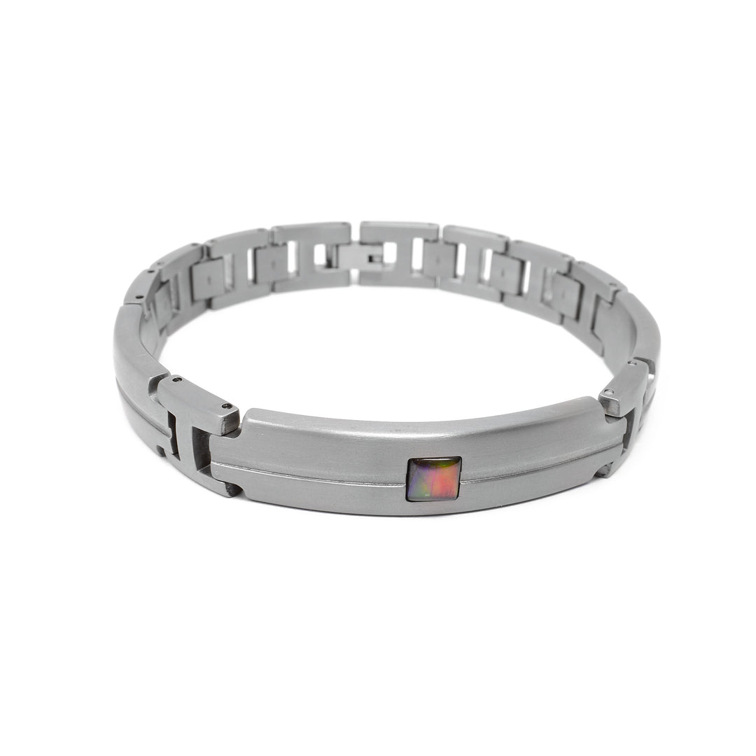 Thick links bracelet. Rounded bar on the front has line indented all the way across and there is a square of A grade ammolite in the center. Two shorter bars with the same design are on the sides, minus the ammolite.
