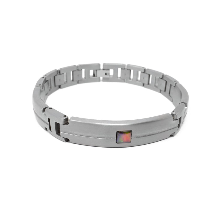 Thick links bracelet. Rounded bar on the front has line indented all the way across and there is a square of A grade ammolite in the center. Two shorter bars with the same design are on the sides, minus the ammolite.