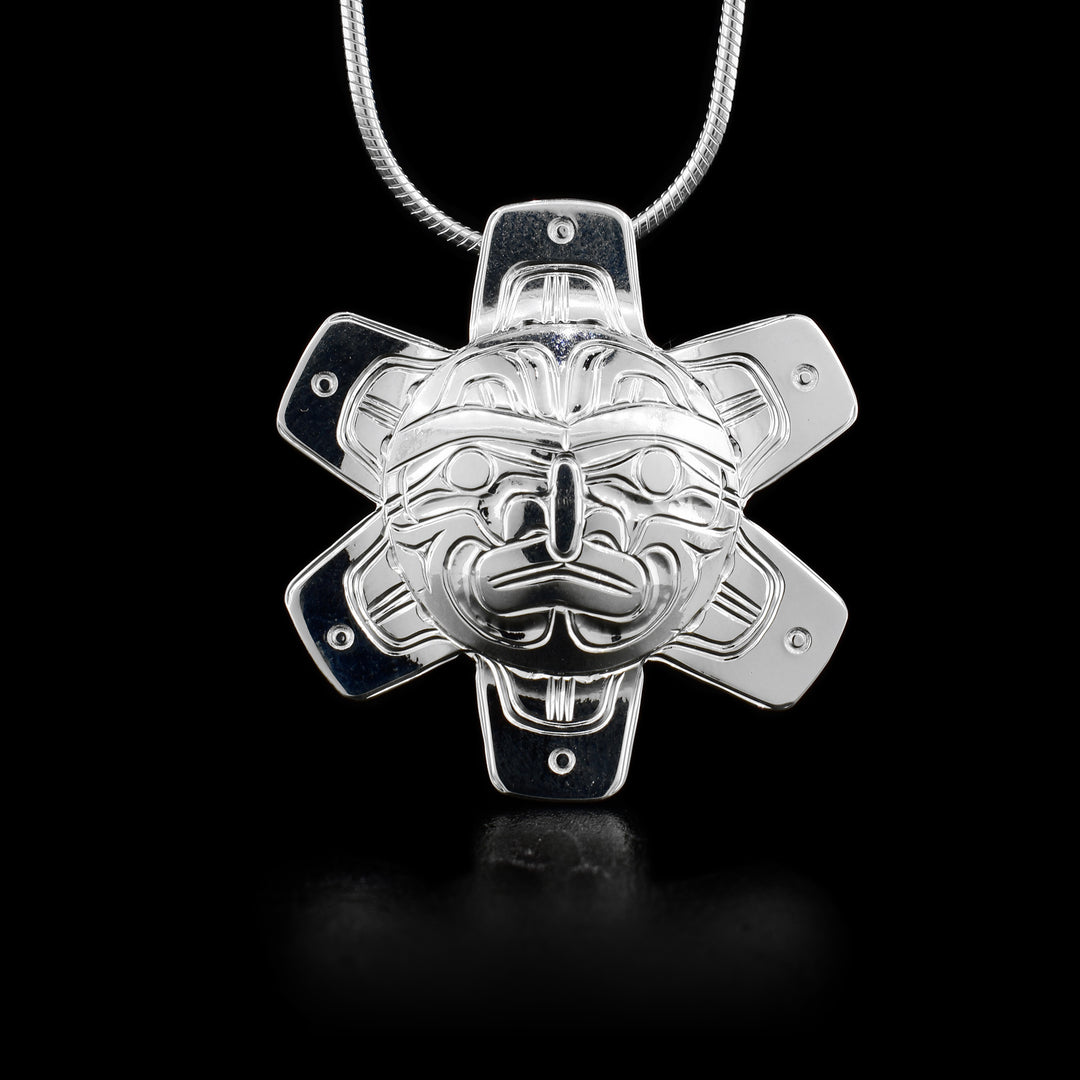 This sterling silver pendant is shaped like the Sun. It has six rays. There is a hidden bail on the back.
