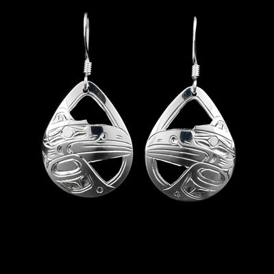 These sterling silver earrings have hooks that have teardrop shaped hangs. The hangs depict the face and wing of the Raven, the background is cut out. 