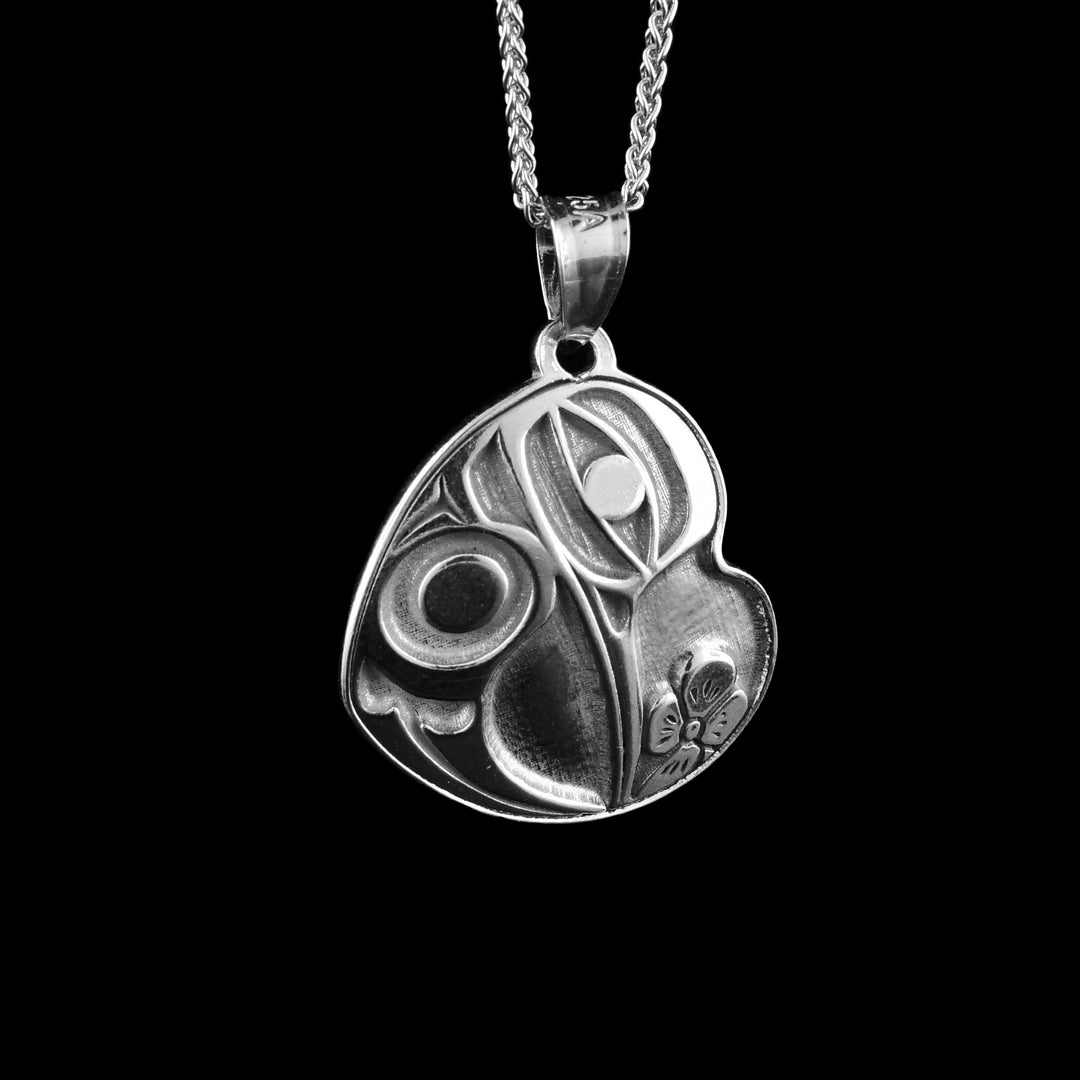 Heart-shaped Hummingbird pendant made with sterling silver.