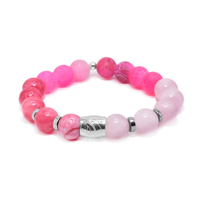 This agate bracelet features pink agate, pink quartz, and rose quartz beads. Along with the hematite spacers, there is a silver charm bead with a carved depiction of the Heron.