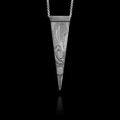 This sterling silver pendant is thin, ends in a point and a depiction of the Eagle is carved into it.