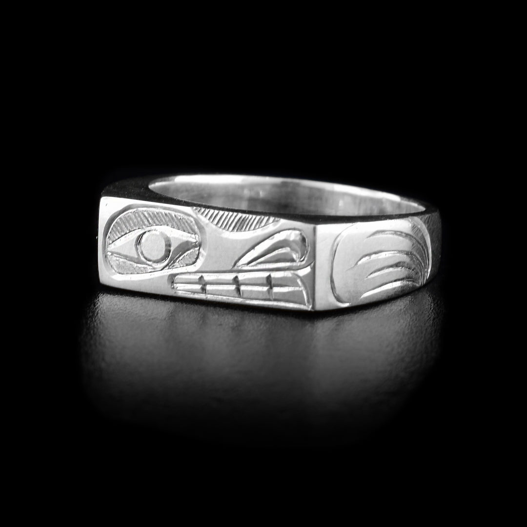 This Wolf signet ring is made from sterling silver and has a thin, rectangle signet with the Wolf carved across the rings surface.