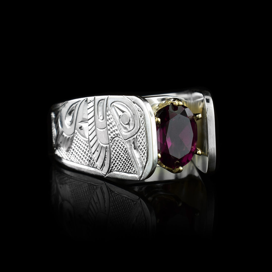 Hummingbird Garnet Solitaire Ring the garnet is held in place with 14k gold prongs.