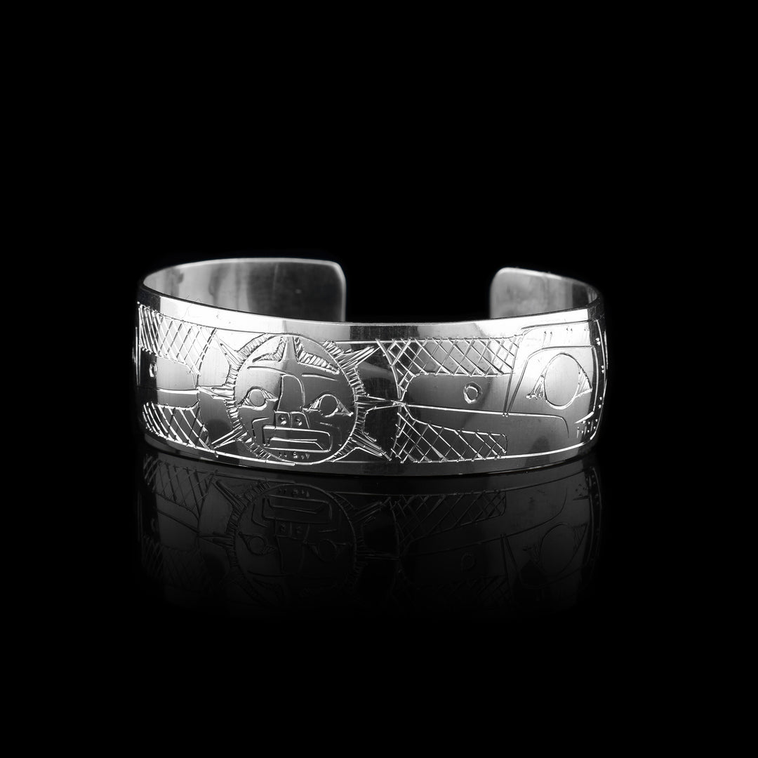 Hummingbird and Moon Baby Bracelet, made with sterling silver the legend of the hummingbird has been carved into either side of the bracelet facing the legend of the moon in the center of the bracelet.