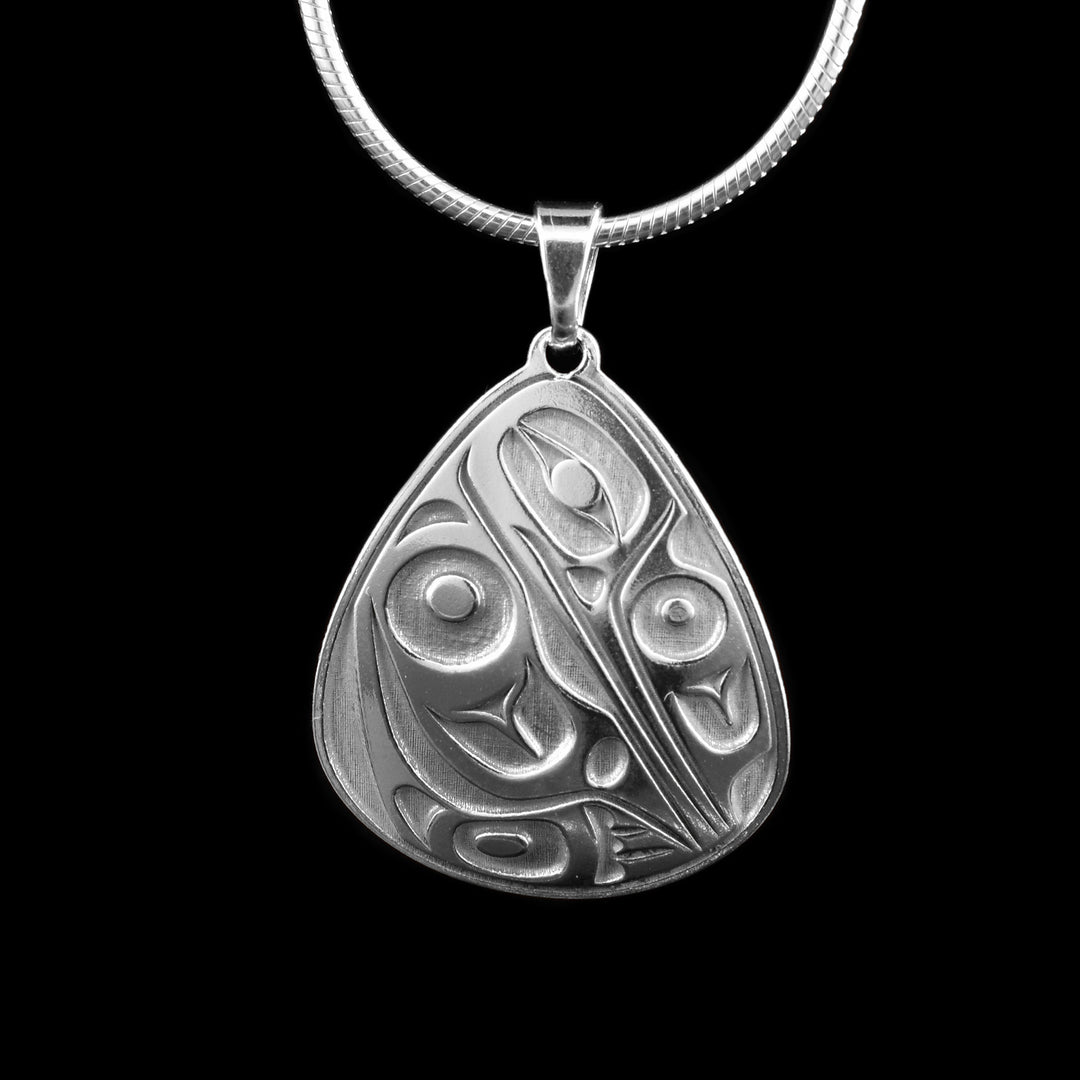 This sterling silver teardrop pendant is hand-carved with the symbolic image of the Hummingbird, its head s pointed down tucking it into its wing.