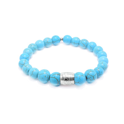 This beaded howlite bracelet is made up of turquoise colored howlite beads. The beads a sphere shaped, small and there is a sterling silver spirit bead in the front of it. There is a depiction of the Sasquatch carved into the spirit bead.