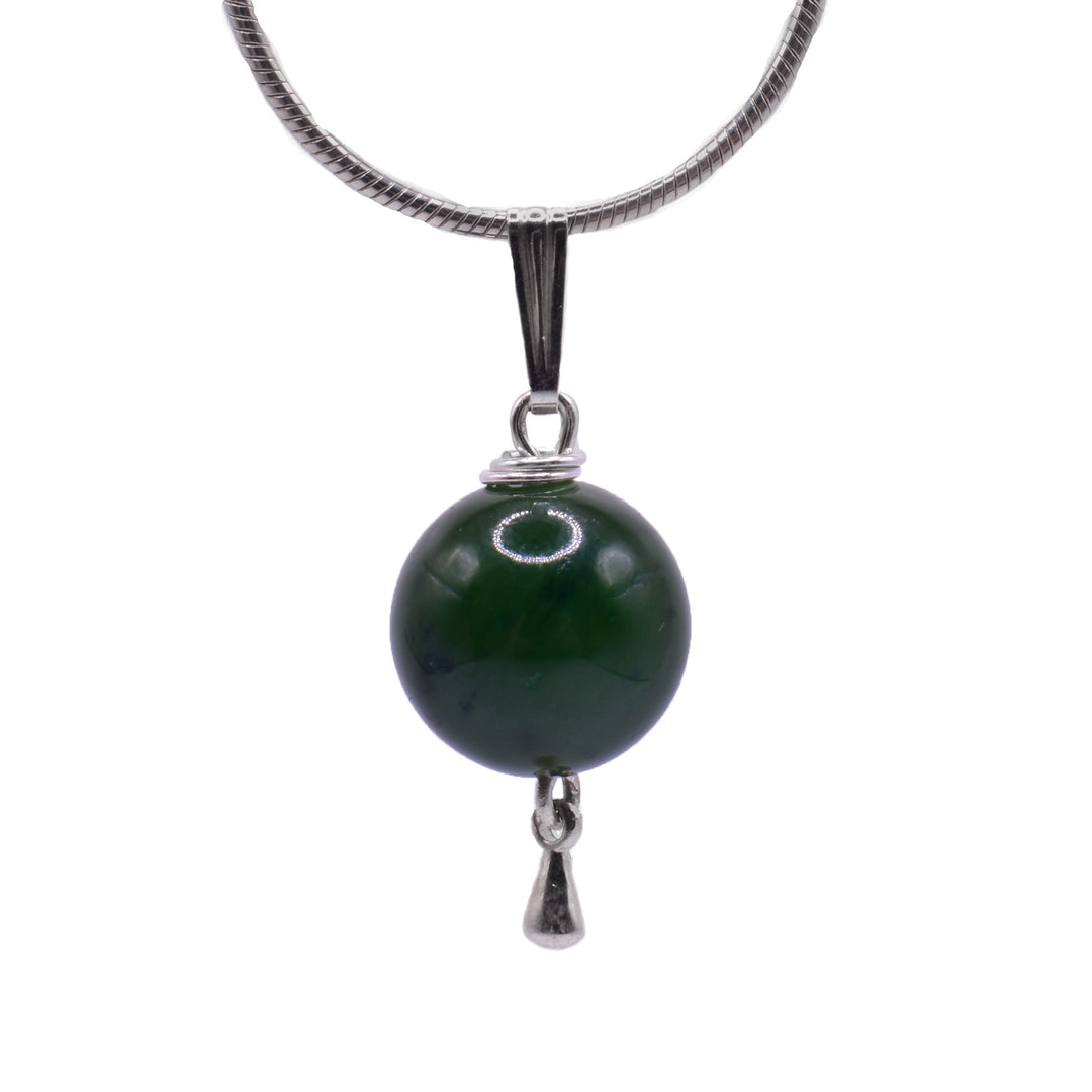This Jade and Silver Teardrop Pendant is elegantly designed with a piece of jade and a small silver teardrop underneath.