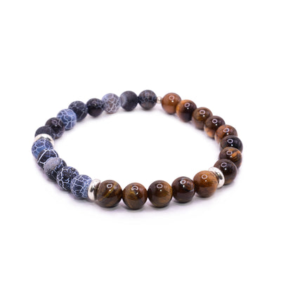 This agate bead bracelet has small, sphere shaped beads made from tiger's eye and agate. Half the piece is purple and blue agate with white patterns and the other half is orange tiger's eye. There are three round, flat spacers made from sterling silver throughout the piece.
