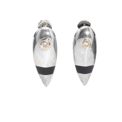These sterling silver diamond earrings are shaped like long, inverted teardrops. At the top of the earring is a diamond wrapped in 14K gold and below that is a band of dark plexiglass.