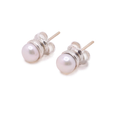 These pearl stud earrings have fresh water pearls held in sterling silver prongs.