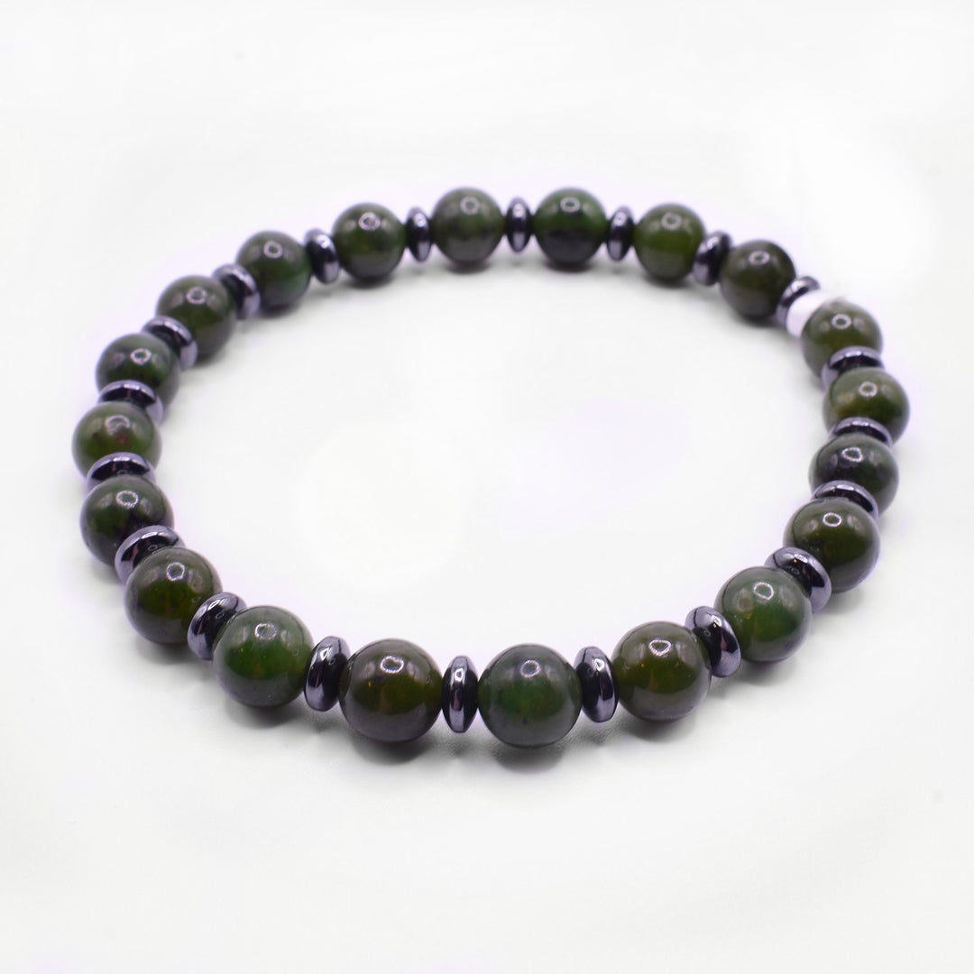 Our Jade Bead Bracelet has small, spherical jade beads with spacers made of small hematite beads.