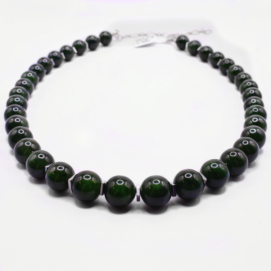 This jade bead necklace has  genuine BC jade beads with smaller, thin and square sterling silver spacers between each one. A sterling silver extender completes the design.