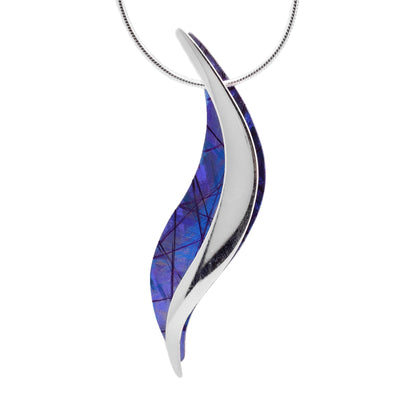 This titanium necklace is made from sterling silver and has blue, anodized titanium on it. The pendant is wavy and half is silver and the other half is titanium.