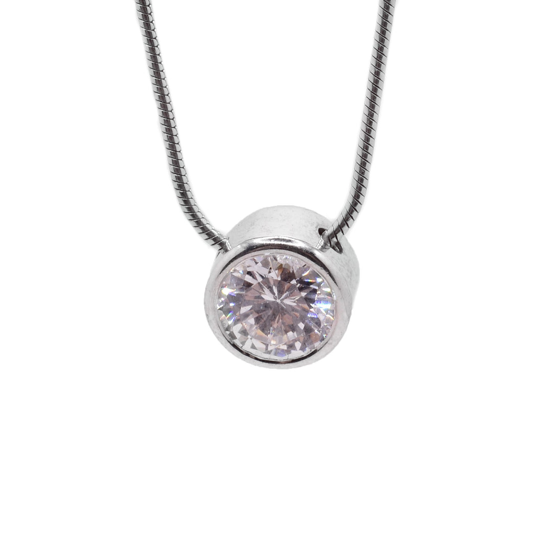 This cubic zirconia necklace has a round chain running through a cubic zirconia gemstone wrapped in sterling silver. 