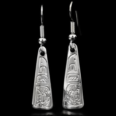 These sterling silver earrings are triangular, with the Orca's face carved in the bottom of the earrings and the dorsal fin at the top.