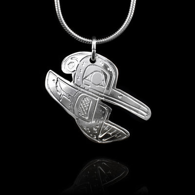 This sterling silver pendant is shaped like the Hummingbird and has carvings on the surface of it that depict the Hummingbird.