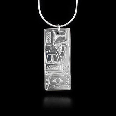 This sterling silver pendant is rectangular with the Orca carved into it.