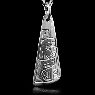 This sterling silver pendant is triangular and has the face of the Wolf handcarved on it. The Wolf is facing downwards.