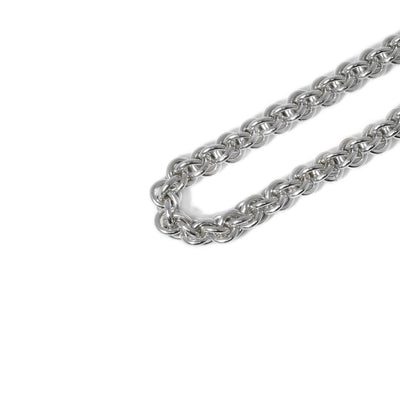 Hand-cut and shaped sterling silver rings are woven together to create a necklace in a braided design. Can be worn with or without a pendant.