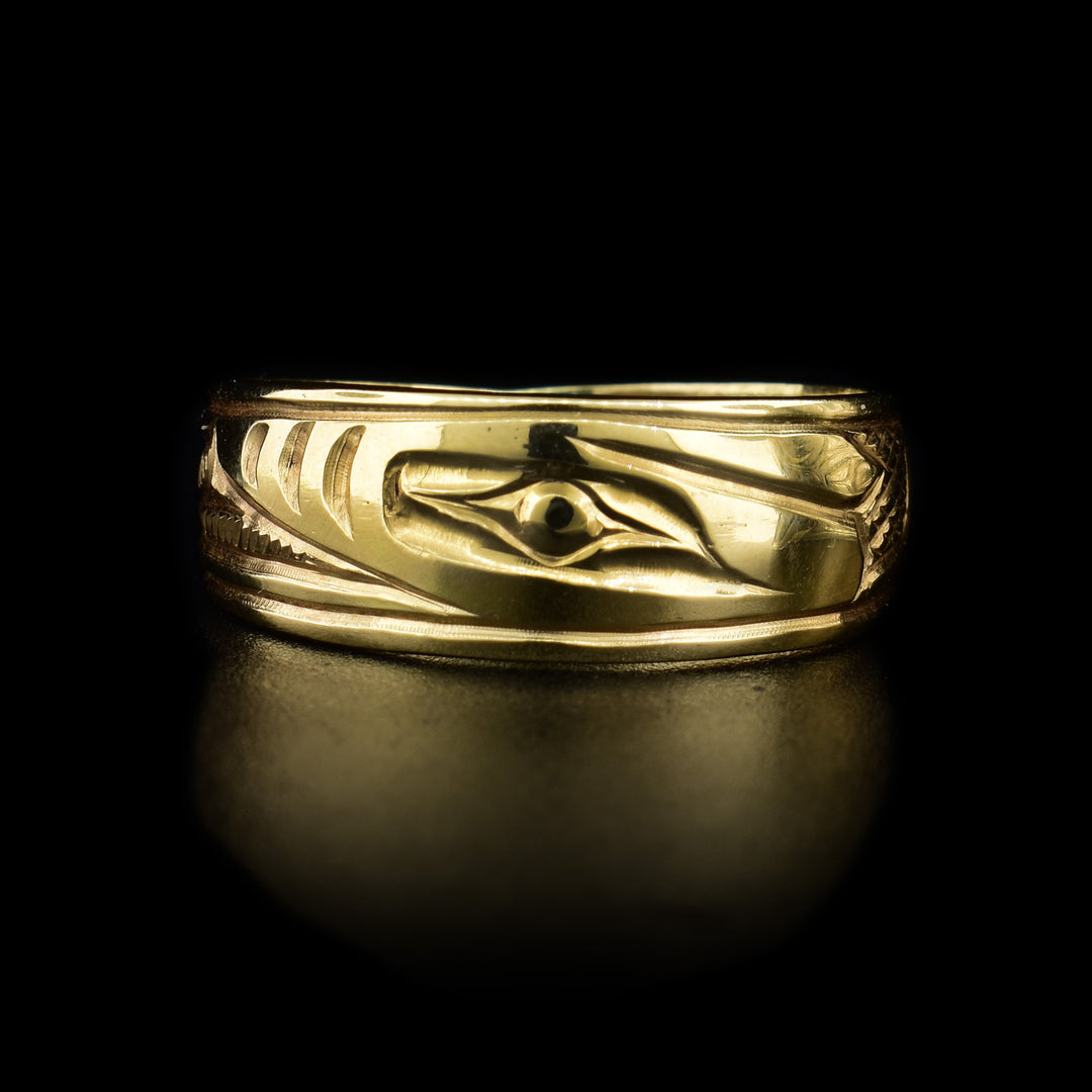 This 14K gold ring has depictions of the Orca carved into it.