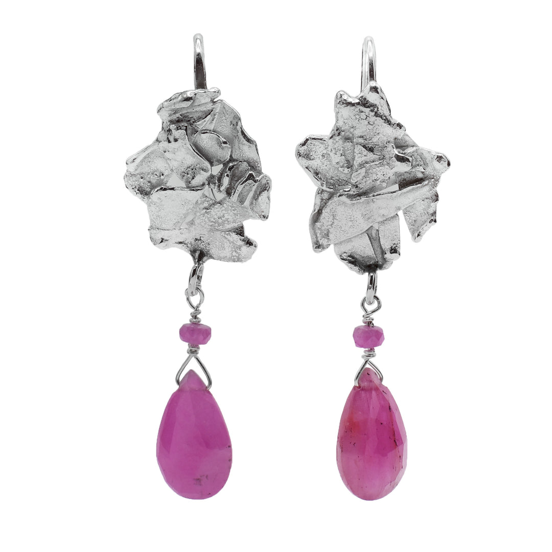 These unique Owyhee opal drop earrings are made from sterling silver and pink opals. The silver hooks have teardrop shaped opal gem hangs on chains.
