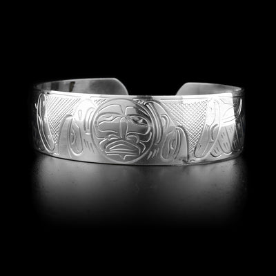 This sterling silver cuff bracelet has depictions of the Eagle, the Raven, and the Moon carved into it.