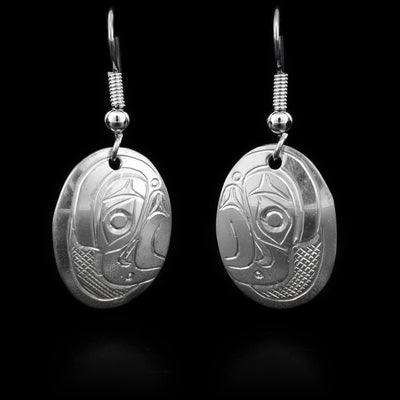 These sterling silver earrings have hooks which have oval hangs. The hangs have the face of the Eagle handcarved onto them.