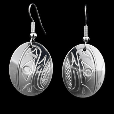 These sterling silver dangle earrings have oval shaped hangs the Eagle etched into them.