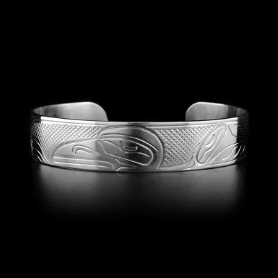 This sterling silver cuff bracelet has a depiction of the Raven carved into it.