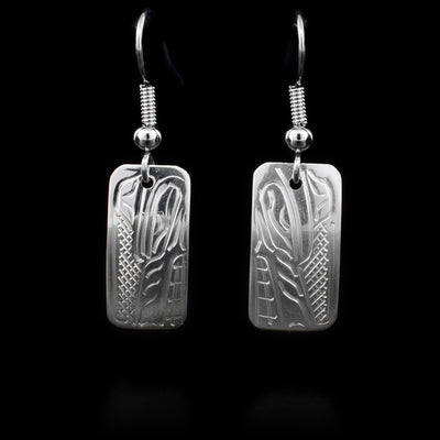 These sterling silver Wolf earrings have hooks that have rectangular hangs. The hangs depict the face of the Wolf, facing downwards.