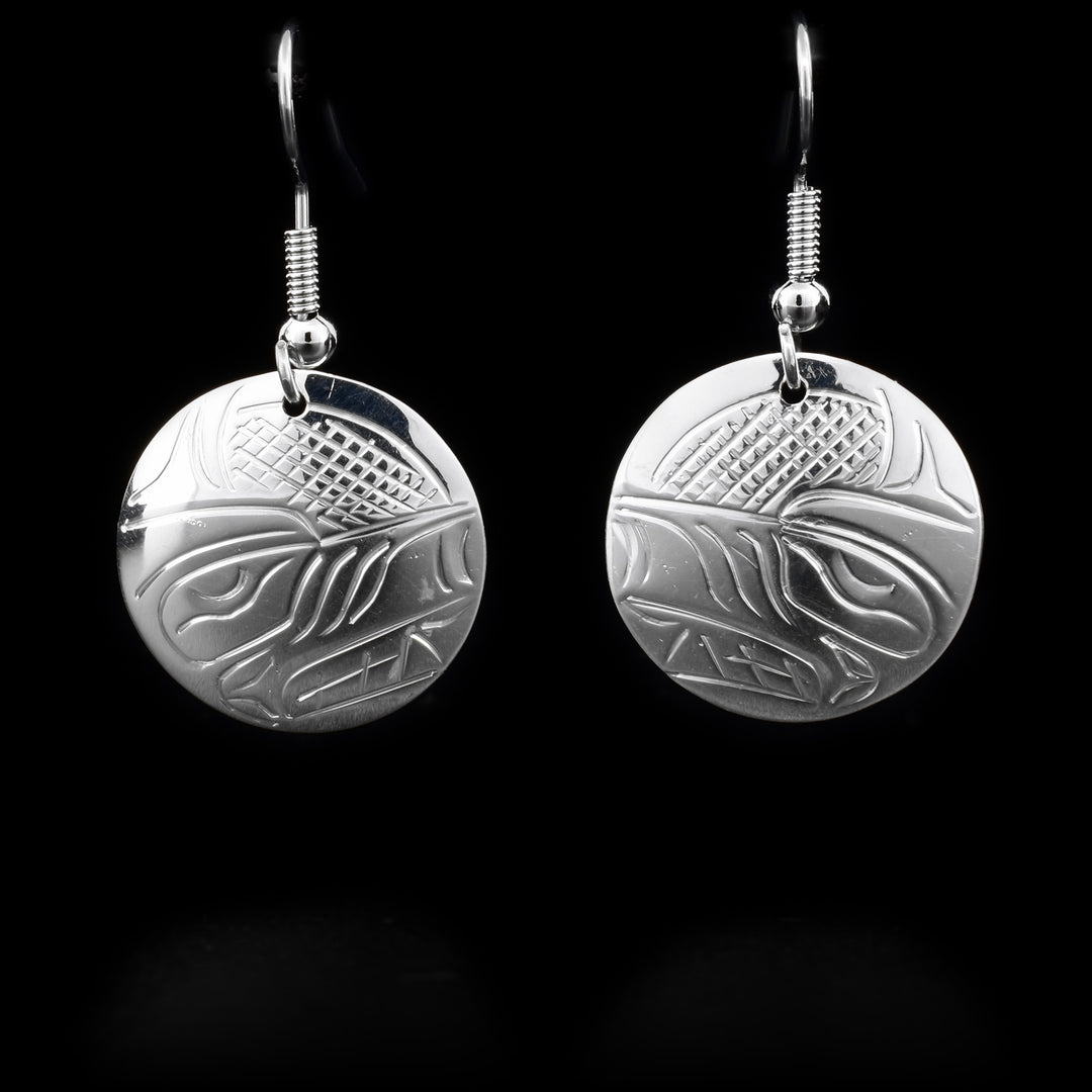 These sterling silver Wolf earrings have hooks which have round hangs. The round hangs depict the face of the Wolf.