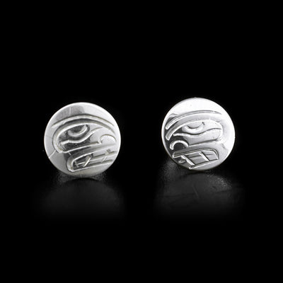 These sterling silver studs are round and depict the face of the Orca.