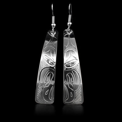 These sterling silver dangle earrings have long hangs with a depiction of the Eagle carved into them.