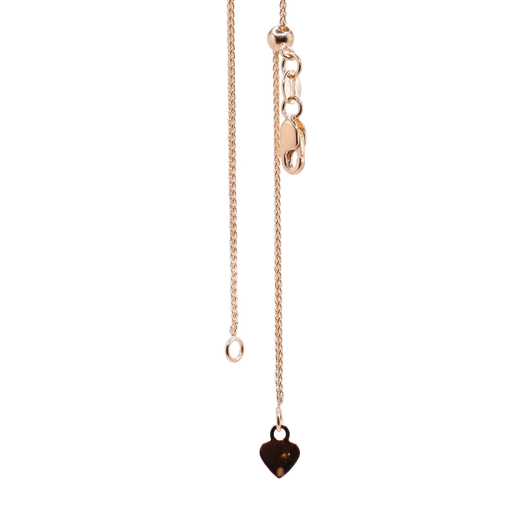 This braided chain necklace is made from 10K gold and has small chain links that are linked together in multiple ways.