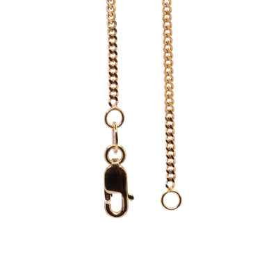 This curb chain necklace is made from 10K gold and has oval shaped links that are twisted to lay flat.