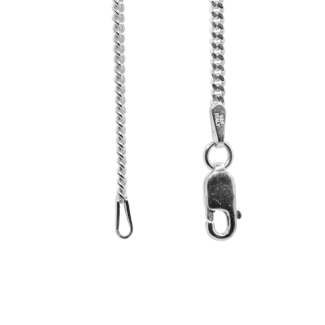 This curb chain necklace is made from sterling silver and has oval shaped links that are twisted to lay flat.