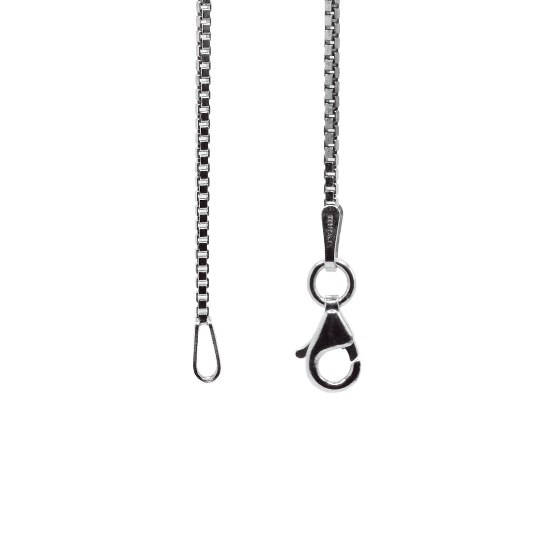 This dainty box chain has small circle shaped links that are wide and is made from plated rhodium.