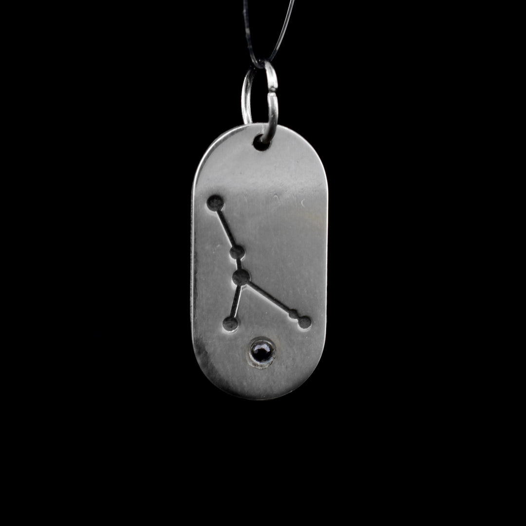 This July zodiac pendant features the July constellation of the Cancer. Underneath is a cubic zirconia.