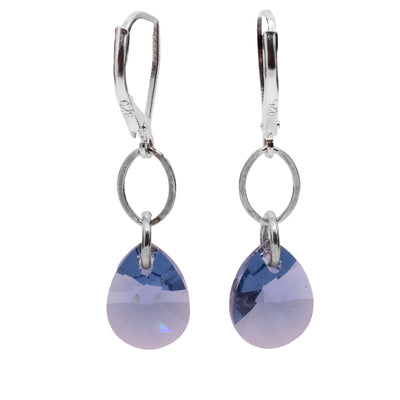 These demin colored, Swarovski crystal dangle earrings have teardrop shaped crystal hangs dangling from sterling silver hoops and hooks.