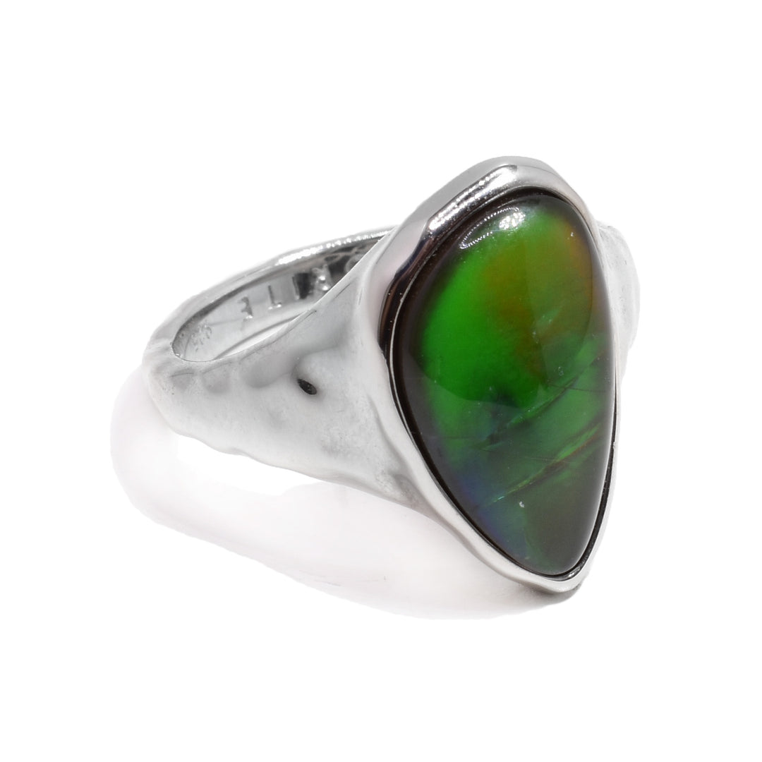 This chunky ammolite ring is made from sterling silver and has a wavy, textured band with a large, oval shaped ammolite gem at the top of the ring.
