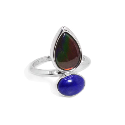 This ammolite ring is made from sterling silver and has an ammolite gem and a lapis gem adorned on the ring