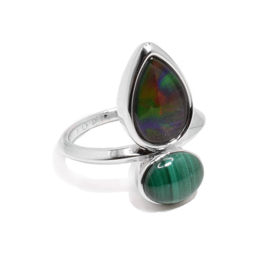 This ammolite ring has a sterling silver band with a teardrop shaped ammolite gem and an oval shaped malachite gem adorned on the top of the ring.