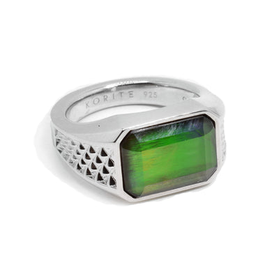 This chunky, ammolite ring is made from sterling silver and has a large, rectangular ammolite gem as the signet of the ring.
